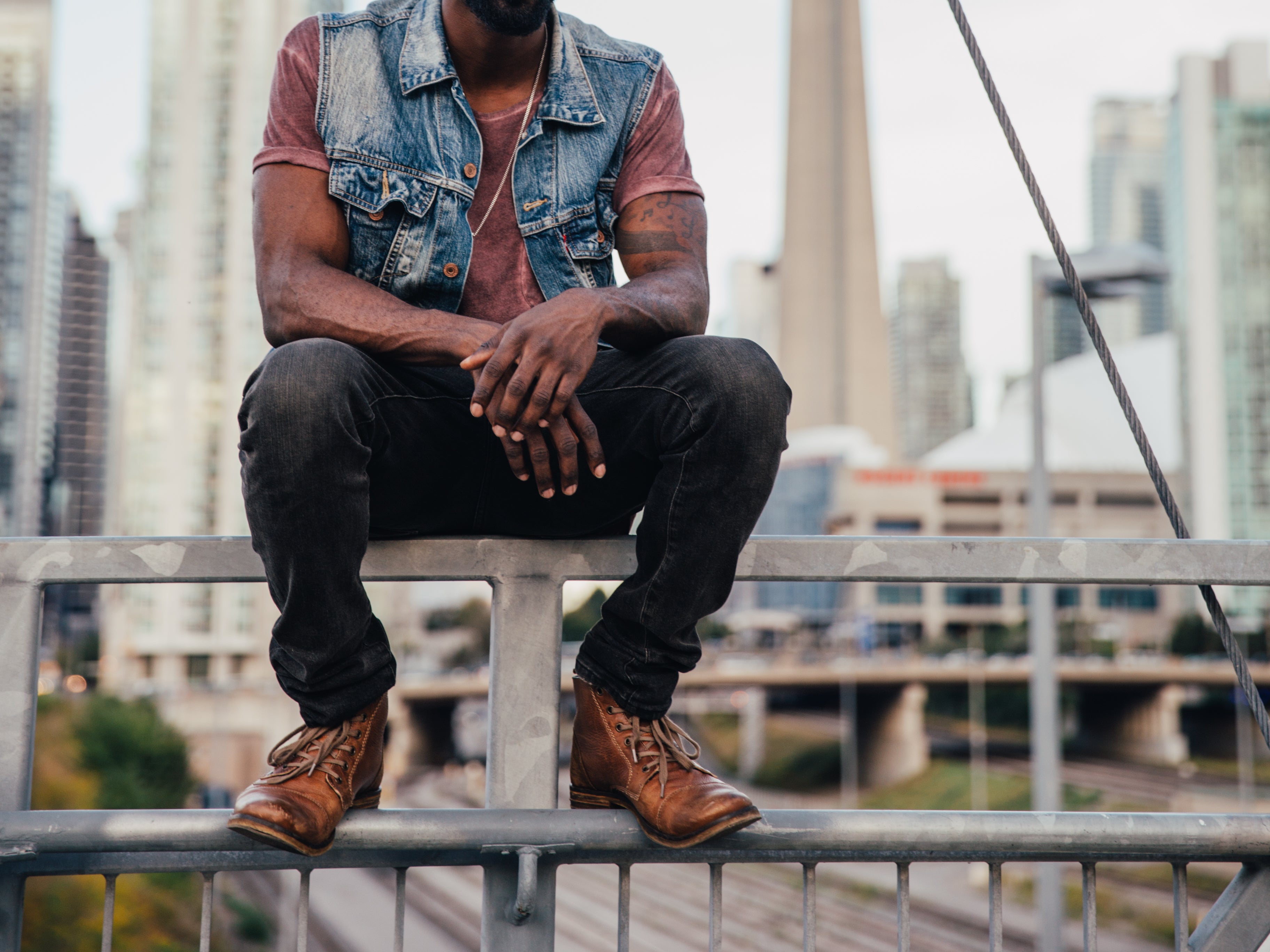 Man sitting in city